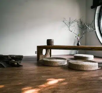 brown wooden bench near window